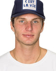 C'est La Vie Trucker Hat in Navy
